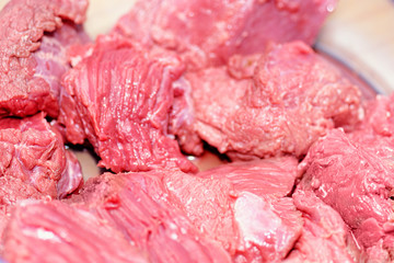 Chopped meat closeup. Fresh cow meat. Juicy slices of fresh meat. Background for the store of meat products. Veal meat.