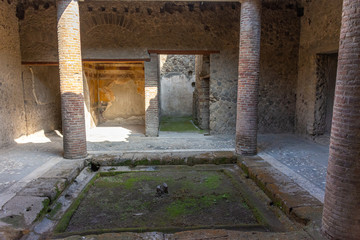 Italy, Pompeii, archaeological area, remains of the city buried by the eruption of ashes and rocks of Vesuvius in 79. Remains of a house with colonnades.