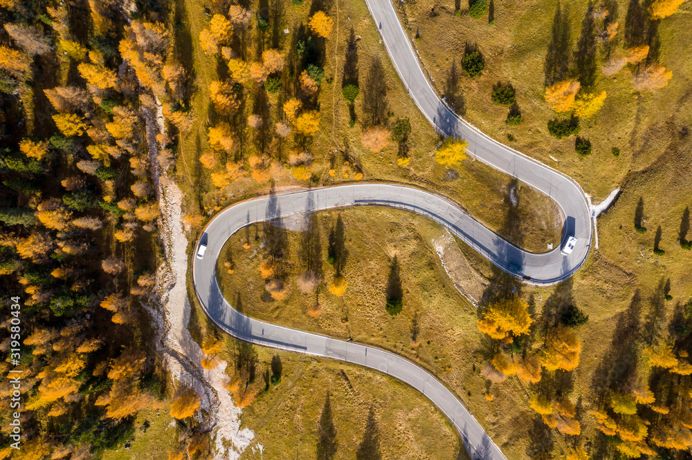 Wall mural drone aerial view - windy road in autumn - Wall murals