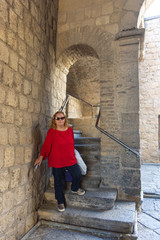 Fototapeta na wymiar Italy, Naples, blonde tourist visits the interior of the castle of Ovo
