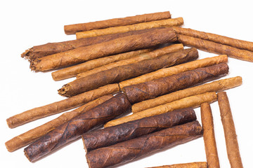 Close up Cuban cigarillo and cigars on white background.