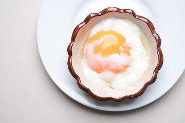 Japanese Onsen Eggs, Onsen Eggs in a Hot Cream Ceramic Cup At Chae Son National Park, Lampang Province, traditional methods of boiling eggs in natural hot springs in Thailand, healthy breakfast.