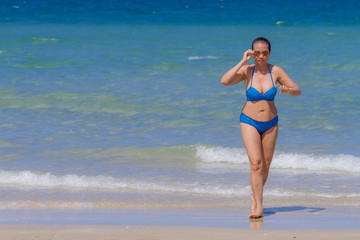 Woman and bikini blue beautiful with sunlight on beach