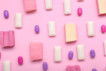 Different chewing gums on color background