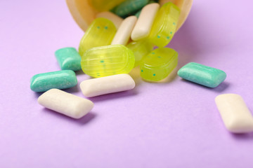 Wafer cone with different chewing gums on color background