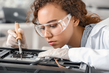 Electronic technician working in service center