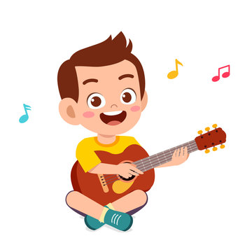 happy cute little kid boy play guitar