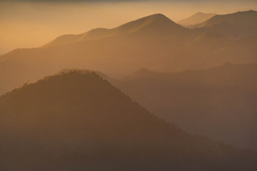 Mountain complex with misty or smoke pollution from wildfire during morning at the northern region of Thailand.