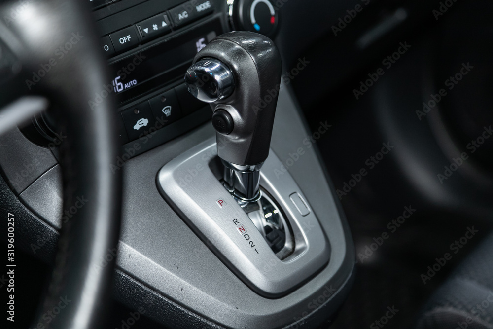 Poster close up of the manual gearbox transmission handle. accelerator handle and buttons in a new car. .