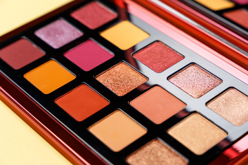 Mua and girly concept. Eyeshadow palette on yellow background, eye shadows cosmetics product as luxury beauty brand promotion. Fashion blog design. Contouring palette. Makeup palette close up