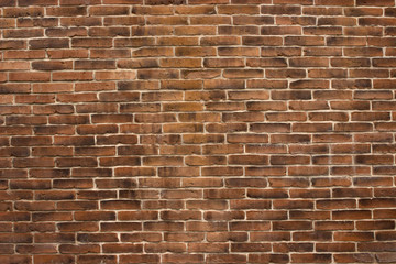 Background of red brown burnt neat brick wall texture