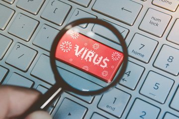 computer virus from internet,  message on enter key of keyboard. Red button with a picture of virus...