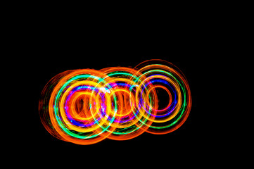 Abstract light painting circles on a black background
