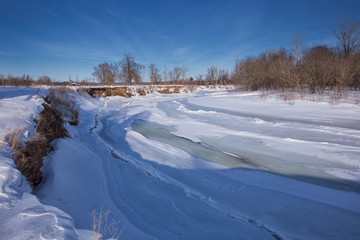 Winter frozen river on a sunny day