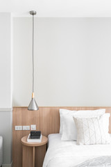 Bedroom Corner with stainless pendant lamp and wooden side table in modern scandinavian style / modern minimal / cozy interior design concept