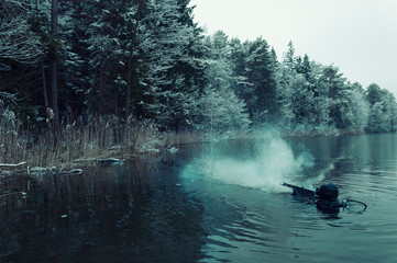 Military diver fires a special weapon in the water. The concept of military special operations,...