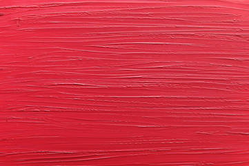 Red lipstick texture, lip gloss close up. Beauty industry concept. Acrylic, oil paint pink brush...