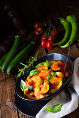 zucchini vegetarian ratatouille with tomato sauce and herbs