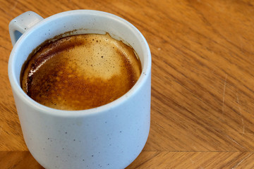 Hot aroma black coffee in ceramic mug on wood table and space for write wording