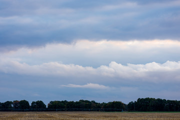 Obraz premium texture of the sky clouds and rays of sun on a background