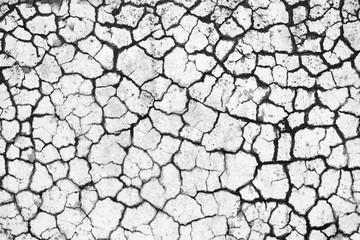 Old concrete wall in the fissures. cracked concrete. Stripes, lines.