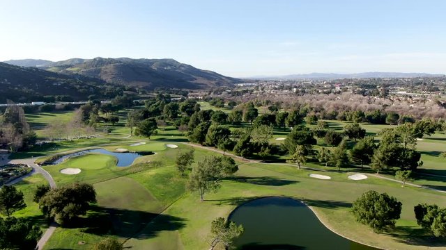 Aerial view of golf course with green field in the valley. Green turf scenery. Temecula, California, USA