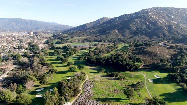 Aerial view of golf course with green field in the valley. Green turf scenery. Temecula, California, USA