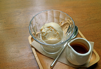 Pitcher of hot espresso coffee with vanilla ice cream in glass bowl for Affogato