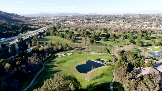 Aerial view of golf course with green field in the valley. Green turf scenery. Temecula, California, USA