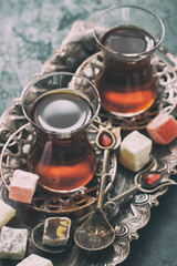 Tea  in glass cups and Turkish Delight on copper tray