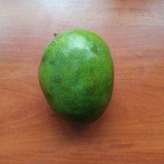 fresh sweet mango on wooden table