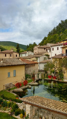Fototapeta na wymiar Autumn view of small stone city in the heart of Umbria, called 