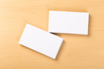 Photo of blank business cards on a general background. Template for identifier. View from above. mock up