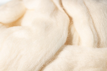 Fototapeta na wymiar the texture of wool yarn for felting