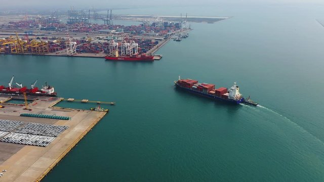 Aerial view of large container cargo ship and Harbor in sea.