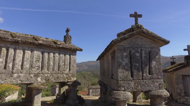 Typical corn stone driers granaries Espigueiros in Soajo village Portugal 4k