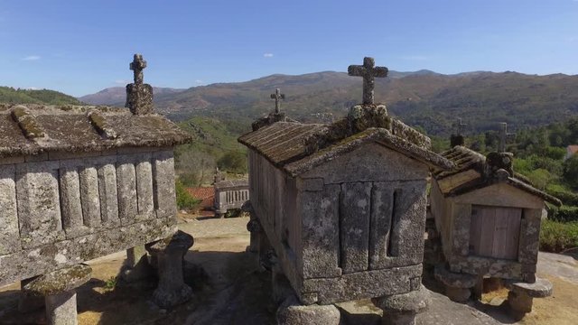 Typical corn stone driers granaries Espigueiros in Soajo village Portugal 4k