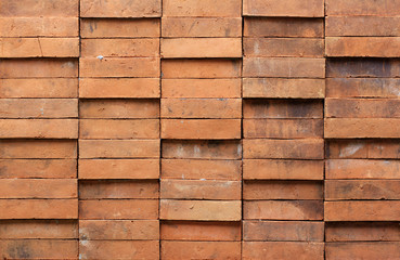 Red brown brick wall, tightly mounted as a fortress.