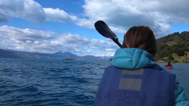 Woman explores limestone rock formation and swims inside the cave (Marble Caves) on the lake General Carrera in Chilean Patagonia, Aysen region, Chile