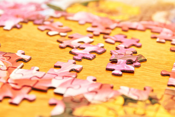 Pieces of a puzzle. Toy. Closeup, selective focus