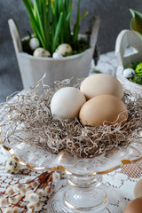 Sophisticated Easter decoration with eggs on crystal stand.