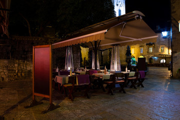 Street cafe at night. Old city in Europe.