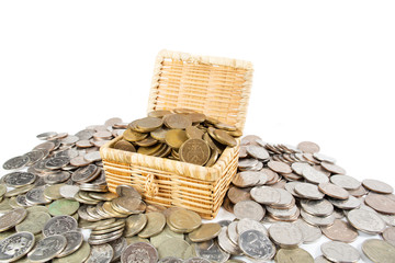 A treasure of money coins lies in and around the chest.