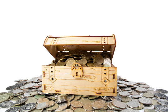 A treasure of money coins lies in and around the chest.