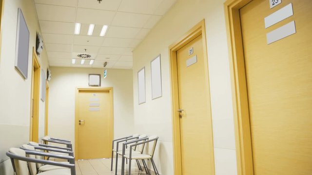 Esthetic and clean modern private clinic or vet waiting room with empty posters	