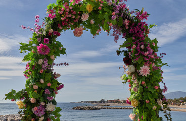 Arc flower at the beach in a sunny day with blue sky