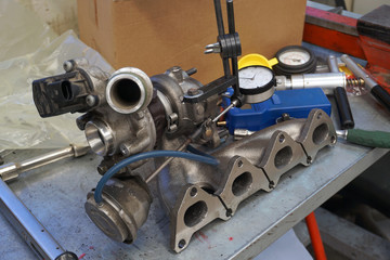 Turbocharger repair in service using precision measuring instruments. 