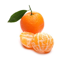 Mandarin with leaf and peeled pieces isolated on white background