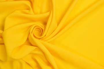 Fabric suit fold top view. Yellow textile