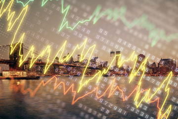 Financial graph on night city scape with tall buildings background double exposure. Analysis concept.